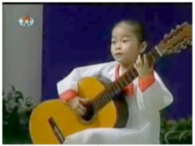 North korean girl playing guitar