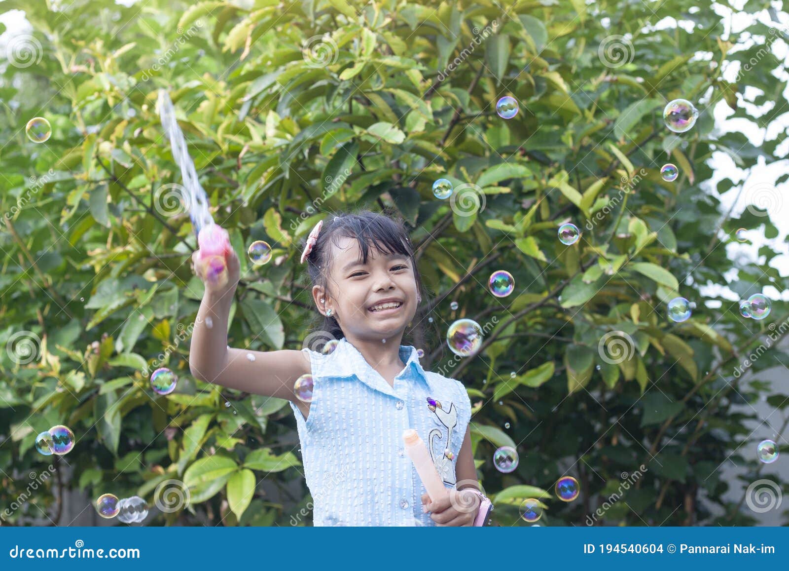 asian watching Bubble outdoor