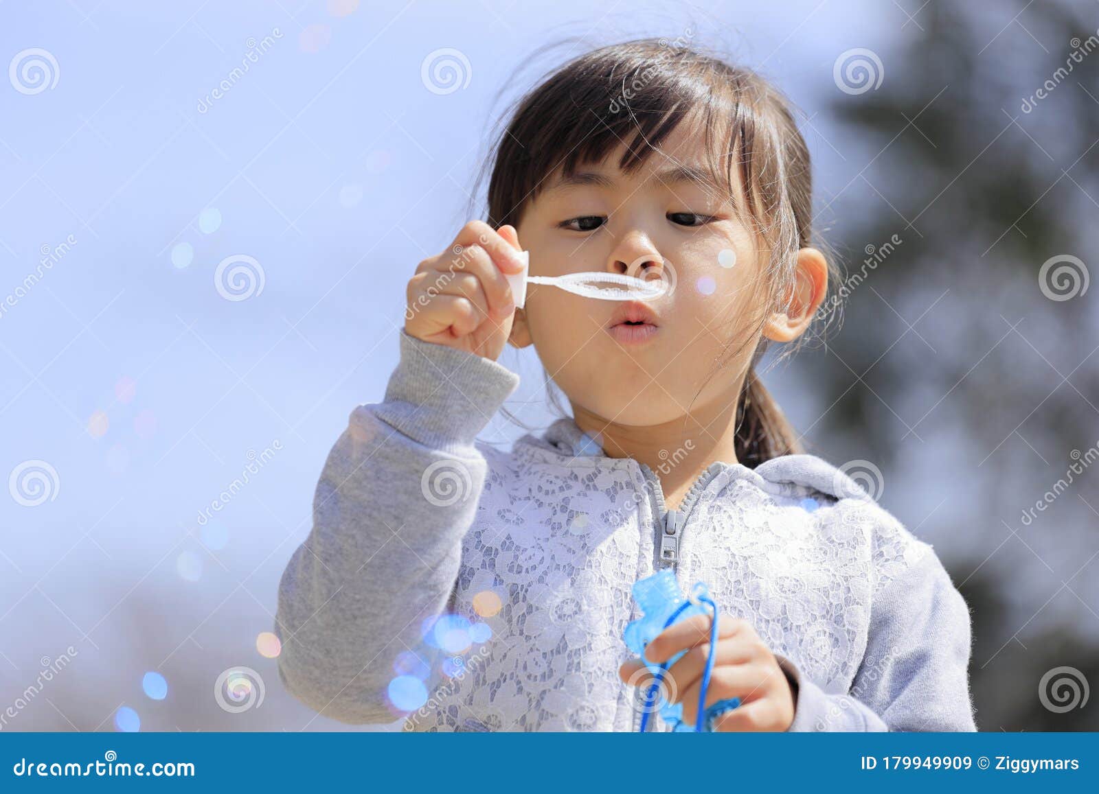 asian watching Bubble outdoor