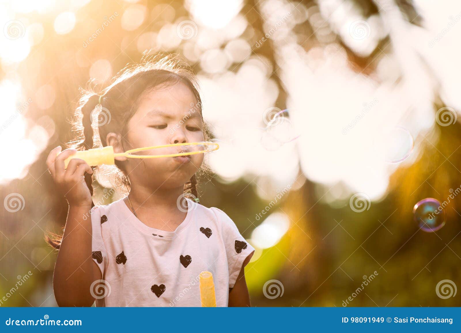 asian watching Bubble outdoor